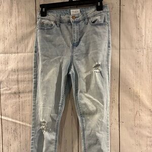 Light wash distressed skinny jeans